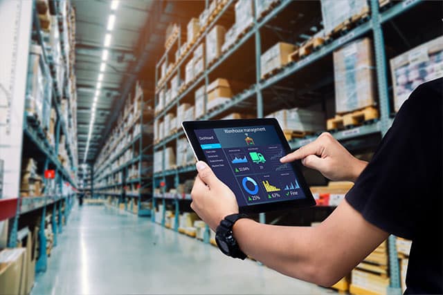 Using a tablet in a warehouse
