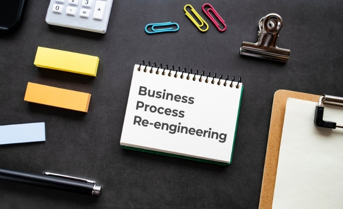 a stylised image showing a notebook showing business process re-engineering