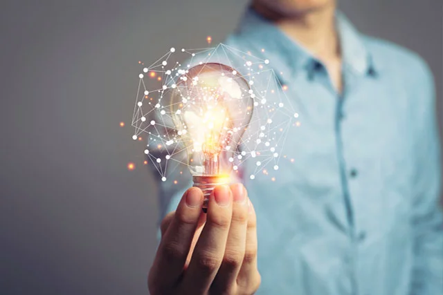 man holding lightbulb