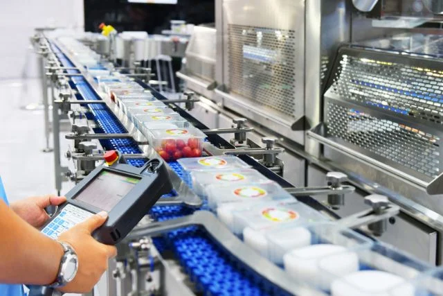 Manager check and control automation Food products boxs transfer on Automated conveyor systems in factory
