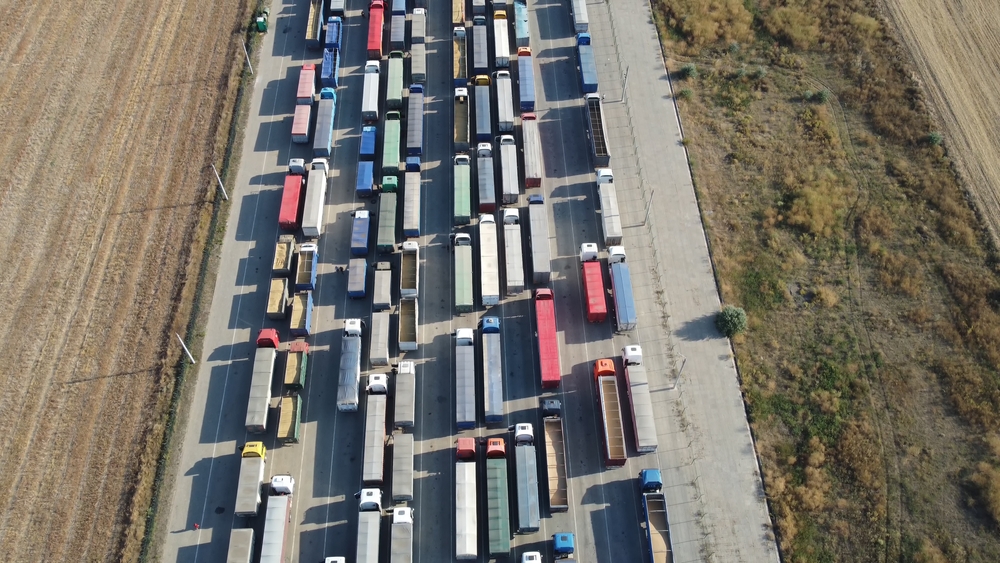 A queue of lorries on a motorway, shown from above