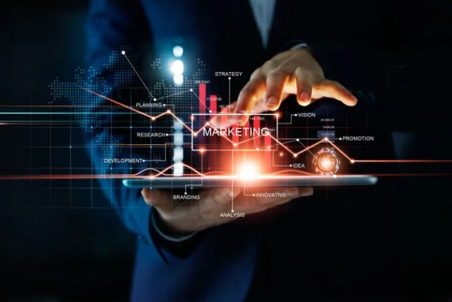 A businessperson's hand manipulates a stylised virtual marketing diagram