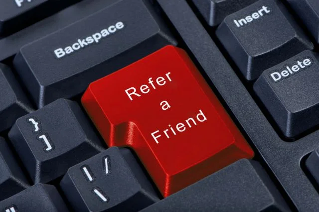 A return key, coloured red, shows the text 'refer a friend'