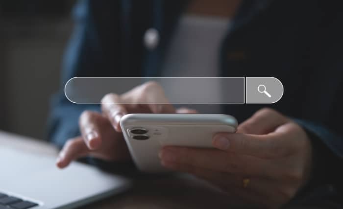 Person using smartphone with search bar overlay on screen for food b2b purchasing