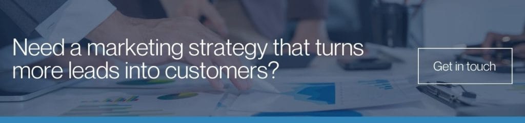 Need a marketing strategy that turns more leads into customers?: Blue-tinted banner over business people reviewing charts and reports, asking if you need a marketing strategy that converts more leads, with a Get in Touch button.